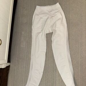 All white leggings with small cutouts